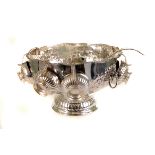 A large silver plated fruit bowl, having repousse floral design, together with cup plated cups and a