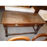 A mid 19th century oak country serving table, with reeded turned legs, united by stretcher, approx