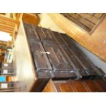 A George II oak chest of drawers, with panelled sides and with one cushion drawer, supported on