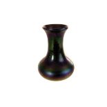 An iridescent bottle vase, possibly Pallme Konig, approx 12cm H