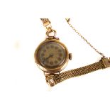 A 1930s 9ct gold cased ladies wristwatch, with Arabic numerals in circular panels