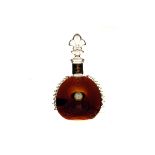 A Baccarat glass cognac display bottle, having yellow metal collar marked Louis XIII Remy Martin