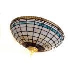 A large Tiffany style ceiling light shade, with multiple coloured glass panels in lead lining,