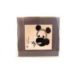 A pair of Chinese paintings, one of a cat and the other of a panda, approx 35cm by 38cm, framed