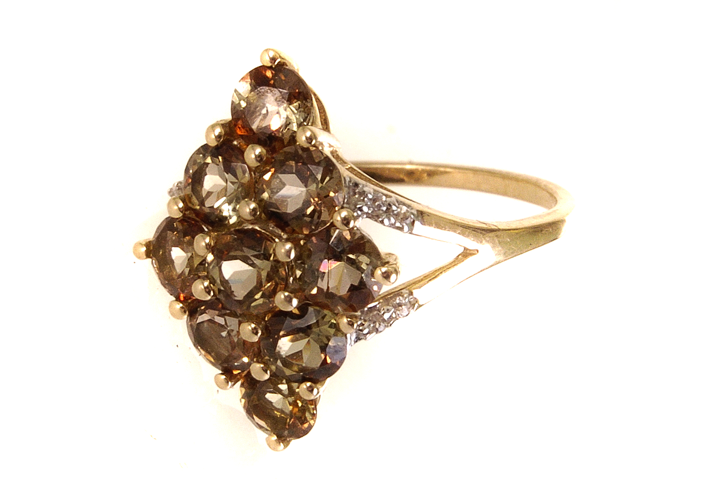 A 9ct gold mystic topaz and diamond dress ring, the nine round cut topaz stones set forming a