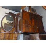 A Victorian mahogany gentleman's compactium dressing chest, with oval mirror over six drawer