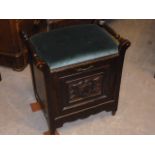A Victorian piano stool, with stuff over seat, two handles, having moulded panel to fall out music