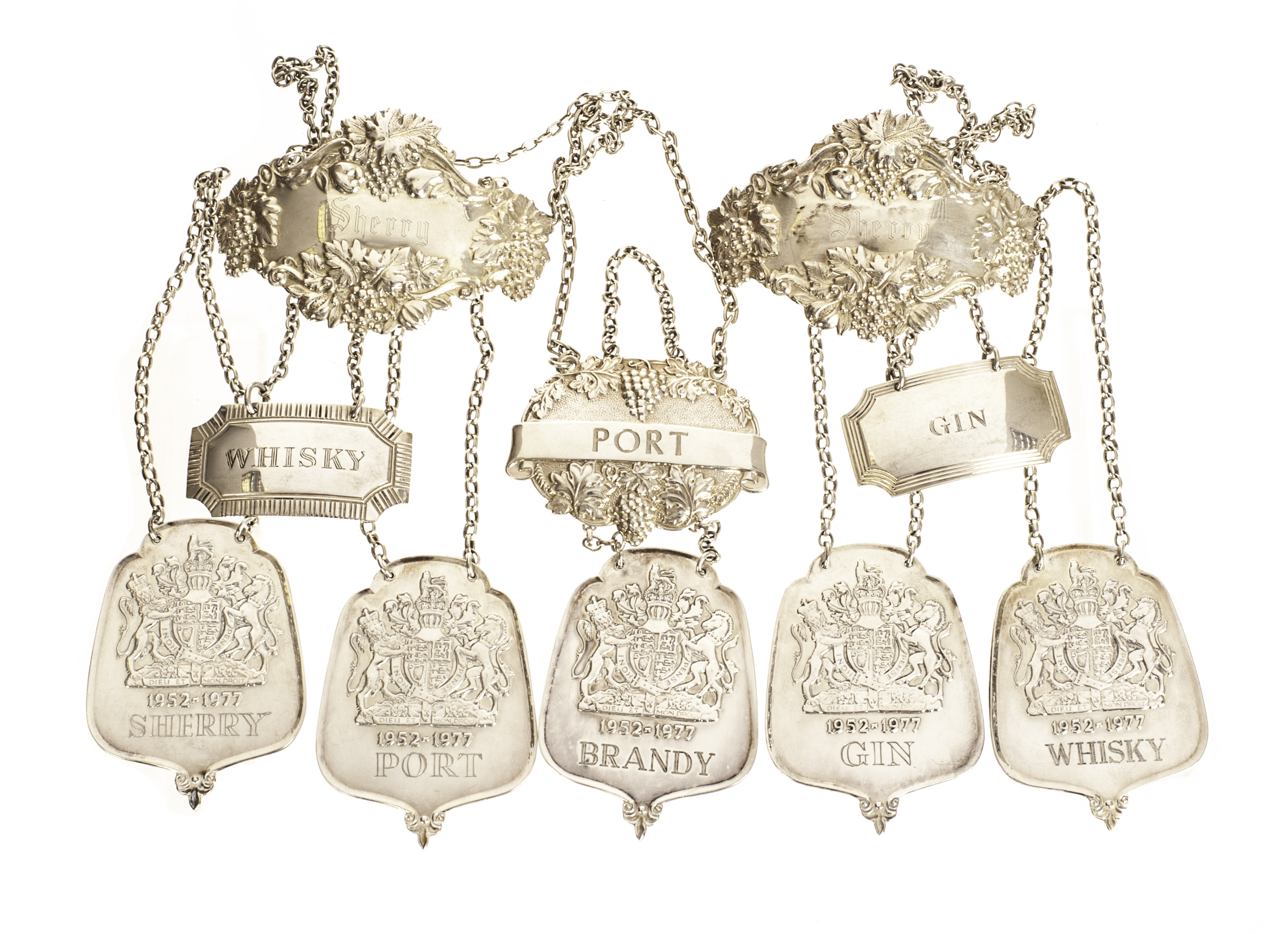 A set of five Silver Jubilee silver spirit labels, bearing the royal coat of arms, plus five of