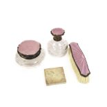 Three George V silver and enamel mounted dressing table items, with pink guilloche, comprising