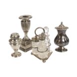 A silver filled dwarf candlestick, together with a silver plated and cut glass cruet set a silver