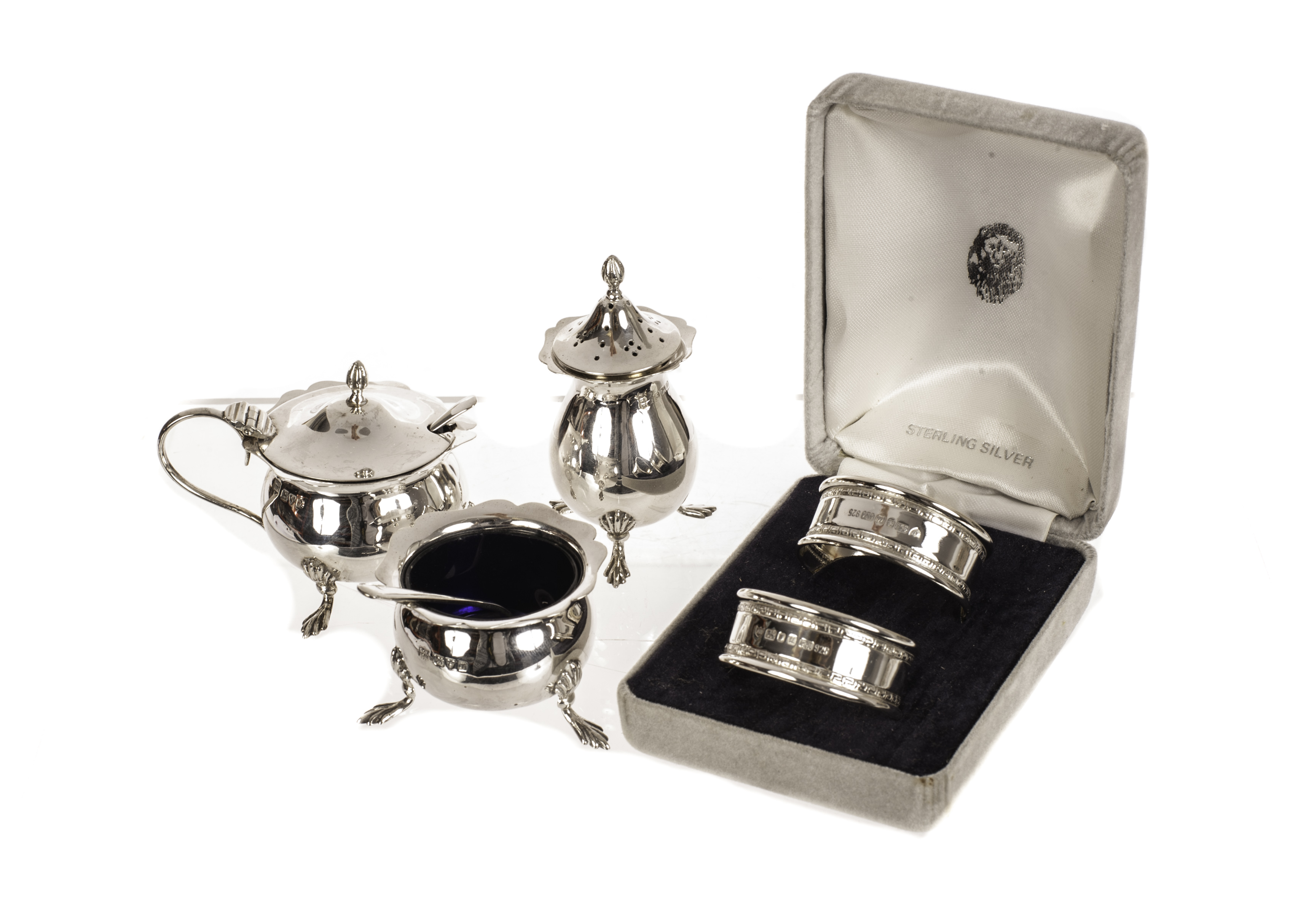 A George V silver cruet set, marks for Chester and Birmingham 1911, plus a boxed pair of silver