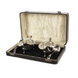 A cased pair of George VI silver sauce boats by EV, with scalloped rims, in fitted case with a