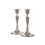 A pair of Edward VII silver table candlesticks, Sheffield 1905, by Hawksworth Eyre & Co., in the