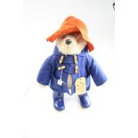 Paddington Bear, stuffed toy, complete with felt hat and coat and boots, felt a little moth eaten