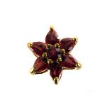 A 9ct gold ruby floral cluster pendant, having central round cut stone surrounded by six pear shaped
