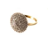 A 9ct gold and diamond cluster ring, the large cone shaped top set with multiple small brilliant cut