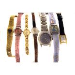 A collection of watches,  including an early 20th century silver cased wristwatch, on ribbon
