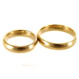 An 18ct yellow gold wedding band set,  finger size S and finger size I, 11g gross (2)