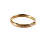 An interesting silver gilt Elizabeth II hinged bangle, with engraved top section, marked Chester