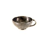 An cute and unusual white metal miniature tea cup, bearing engraved inscription "Cheerio Best Of