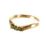 A 9ct gold green diamond three stone ring, the three round cut diamonds set in a 9ct gold band, size