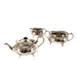 A pair of silver plated trumpet vases, together with a three piece silver plated tea set, two