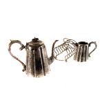 A four piece electroplated tea and coffee service,  of tapering cylindrical form, engraved overall