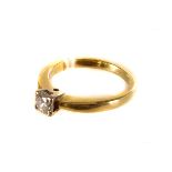 A single stone diamond ring,  the central brilliant cut .37 ct set in a four prong mount, the