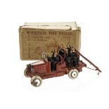 A Johillco Miniature Fire Engine, compete with six firemen, ladder and bell, in original box,