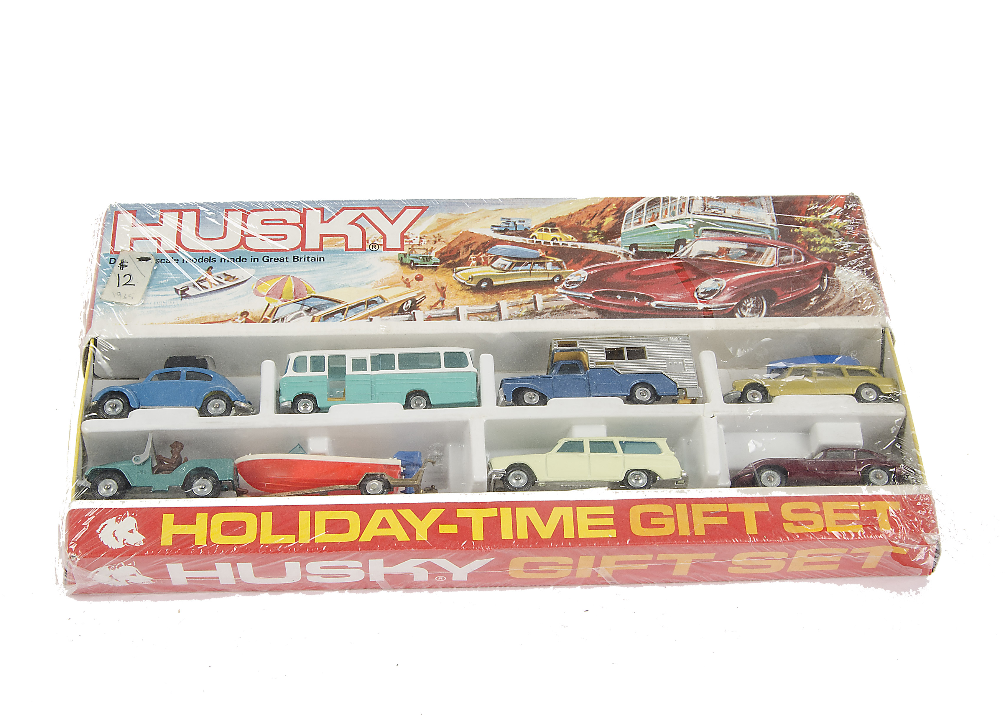 A Corgi Husky Holiday Time Gift Set, comprising seven vehicles and trailer, in original gift set