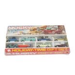 A Corgi Husky Holiday Time Gift Set, comprising seven vehicles and trailer, in original gift set