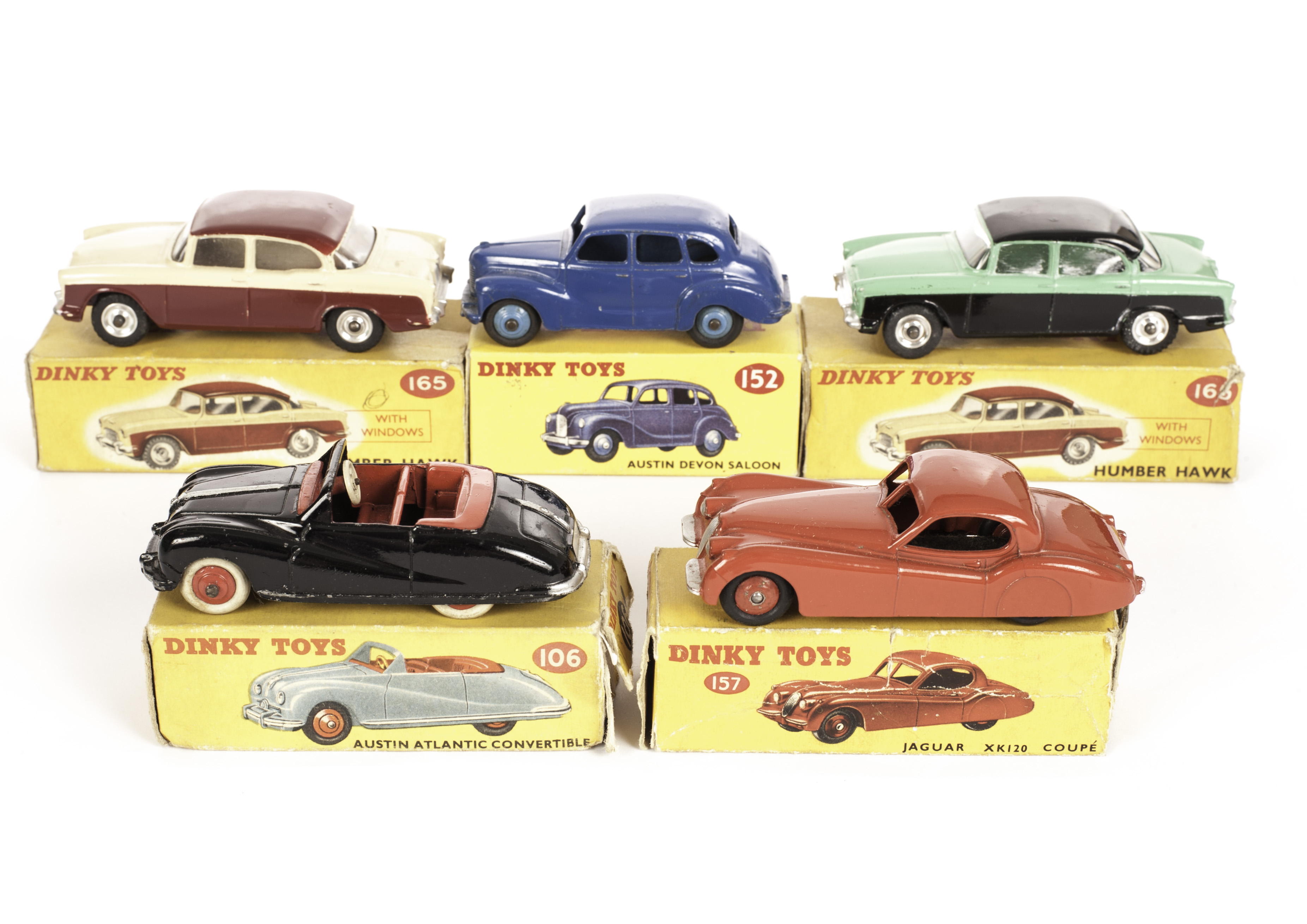 A Dinky Toys 152 Austin Devon Saloon, dark blue body, mid-blue hubs, 157 Jaguar, red body, 165