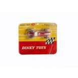 A Dinky Toys 206 Maserati Racing Car, red body, yellow plastic hubs, sealed in original blister