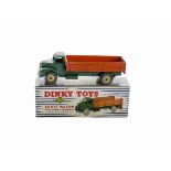 A Dinky Toys 932 Comet Wagon With Hinged Tailboard, dark green cab and chassis, orange back, cream