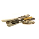 A collection of Victorian and later silver handled button hooks, sewing items and more, including