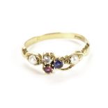 A pretty gold and gem set ring, having a diamond, ruby and sapphire to centre and a pearl to