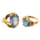 Two 9ct gold and gem set dress rings, both set with blue stones, one larger example in pierced