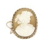 A Victorian period shell cameo brooch, the oval panel depicting a Bacchus style figure with well