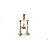 A pair of Elizabeth II silver candlesticks, marked Birmingham 1958, together with another similar (