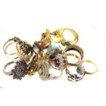 A collection of silver and gem set and other fashion rings, in varying designs, some marked 925 or