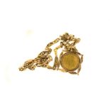 A 9ct gold mounted replica medieval coin pendant, the Henry VIII style gold coloured coin in