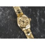 A 14ct gold Rolex Oyster Perpetual lady’s wristwatch, having black baton numerals to gold dial, in