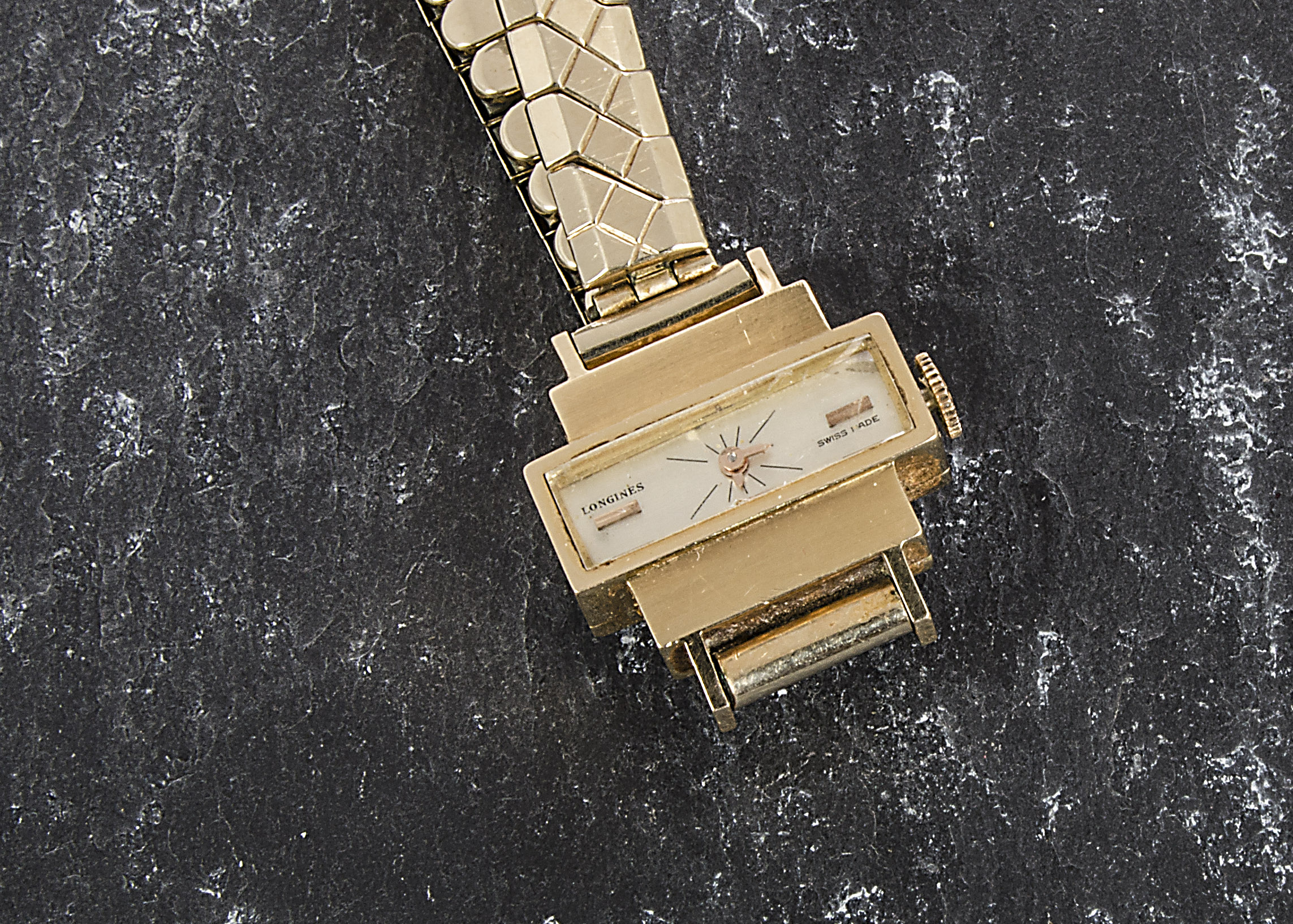 A 1960s 18ct gold cased lady’s Longines wristwatch, the retro case supported on a later expanding