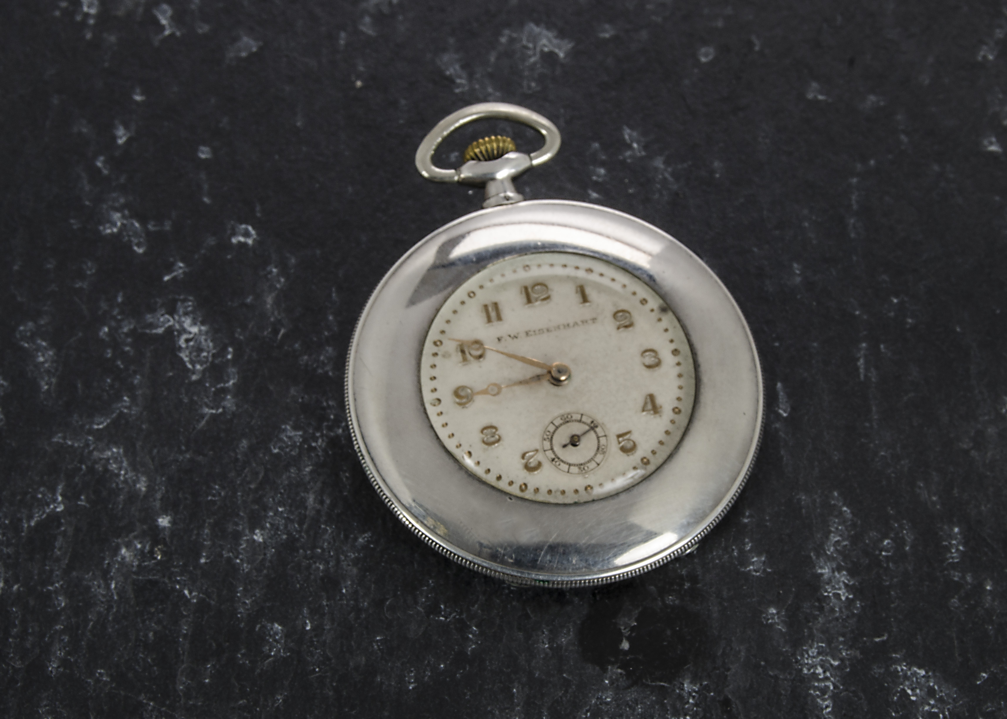 A stylish Art Deco slimline continental silver open faced pocket watch from F.W. Eisenhart, Swiss