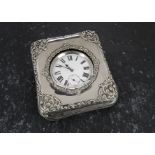 A silver Goliath pocket watch stand and watch, the chromed oversized pocket watch in leatherette