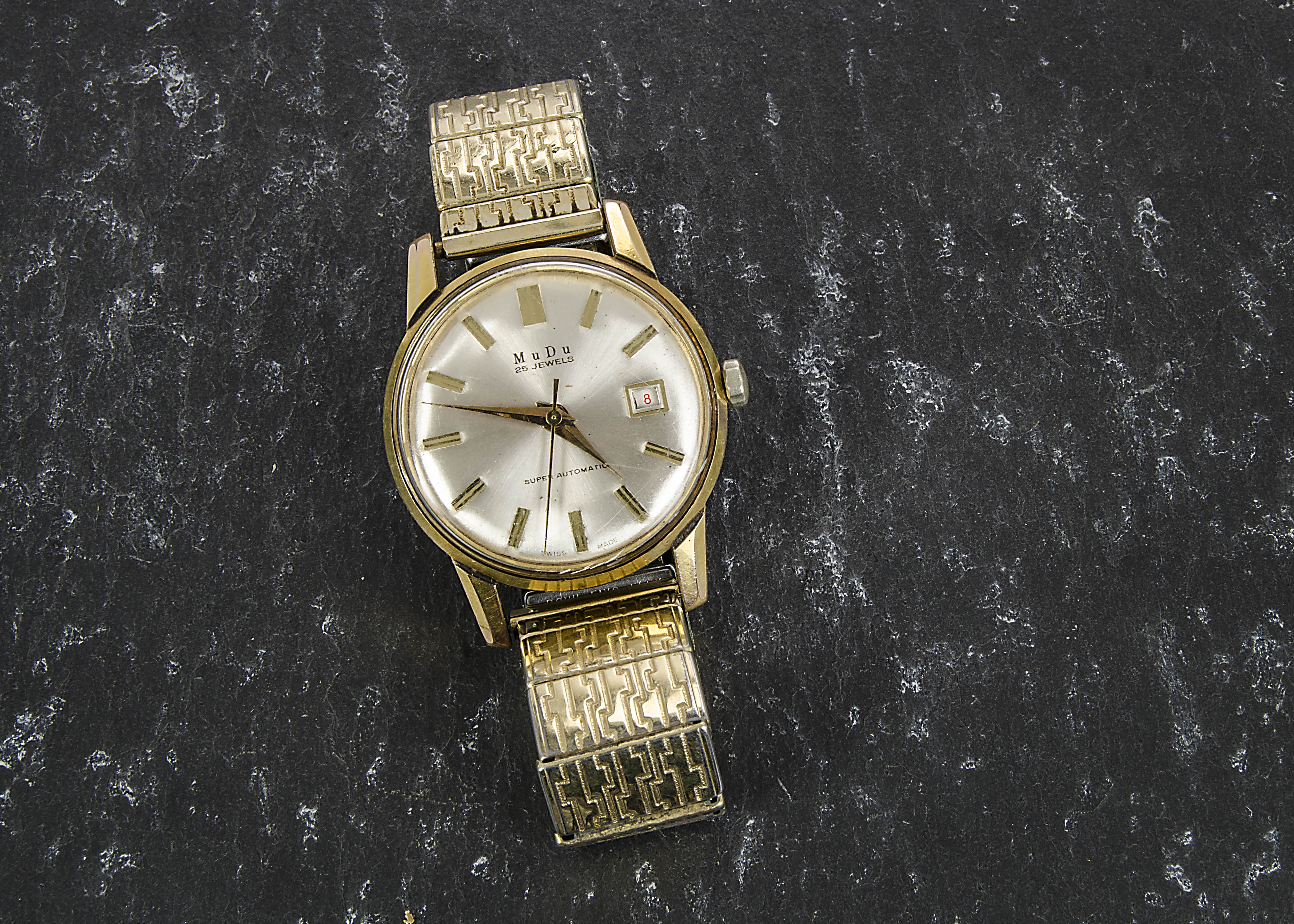 A MuDu gentleman’s gold plated automatic wristwatch, the brushed silver dial, applied baton