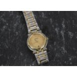 A lady’s Gucci bracelet watch, quartz movement, champagne dial with gilt hour markers, bimetal