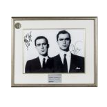 The Krays: Framed and glazed black and white photograph of Martin and Gary Kemp signed in black pen,