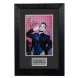 Robbie Williams / Autograph: Framed and glazed colour print signed Love Robbie Williams, with UACC