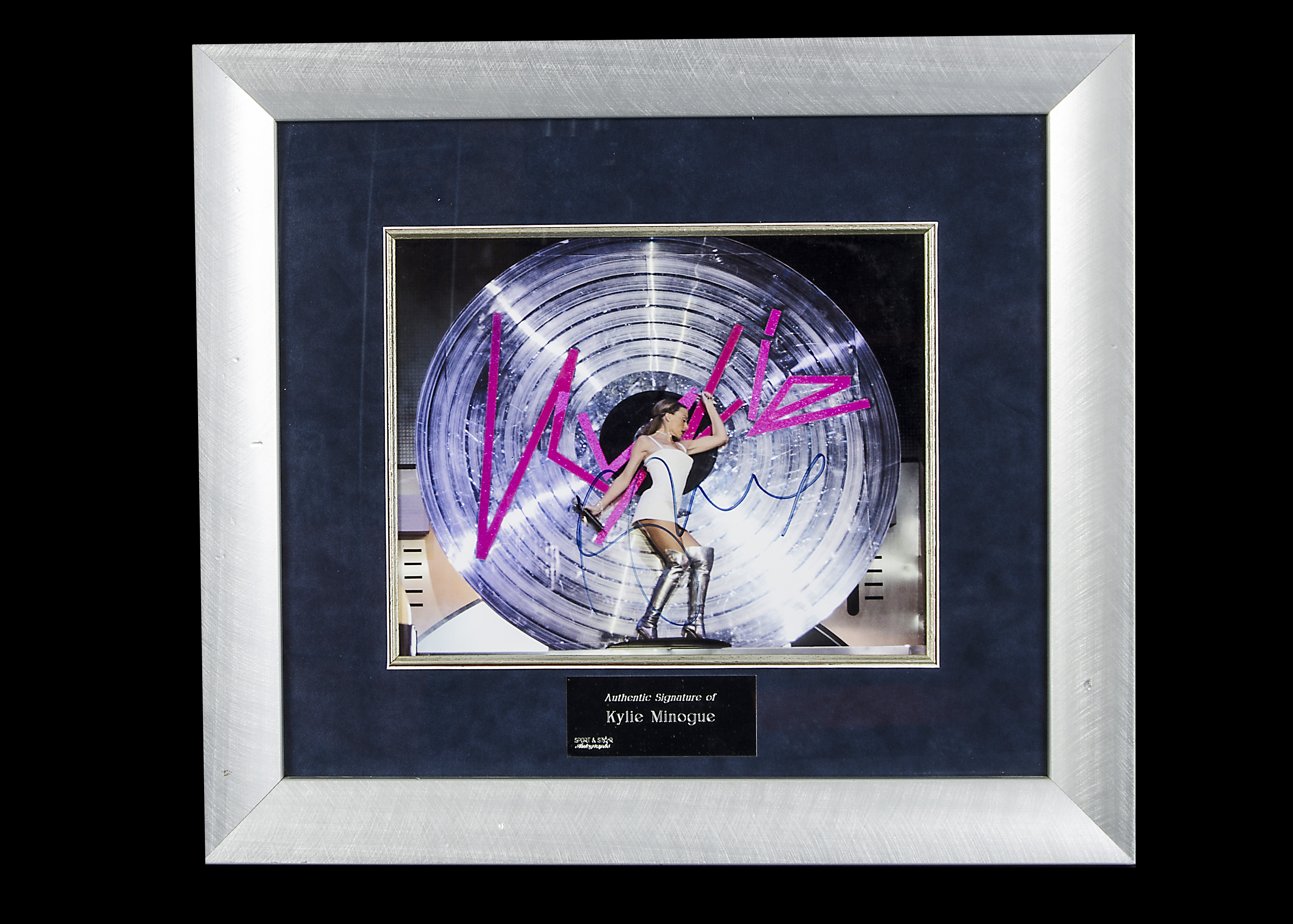 Kylie Minogue / Autograph: Framed and glazed colour print signed Kylie, with UACC certificate of